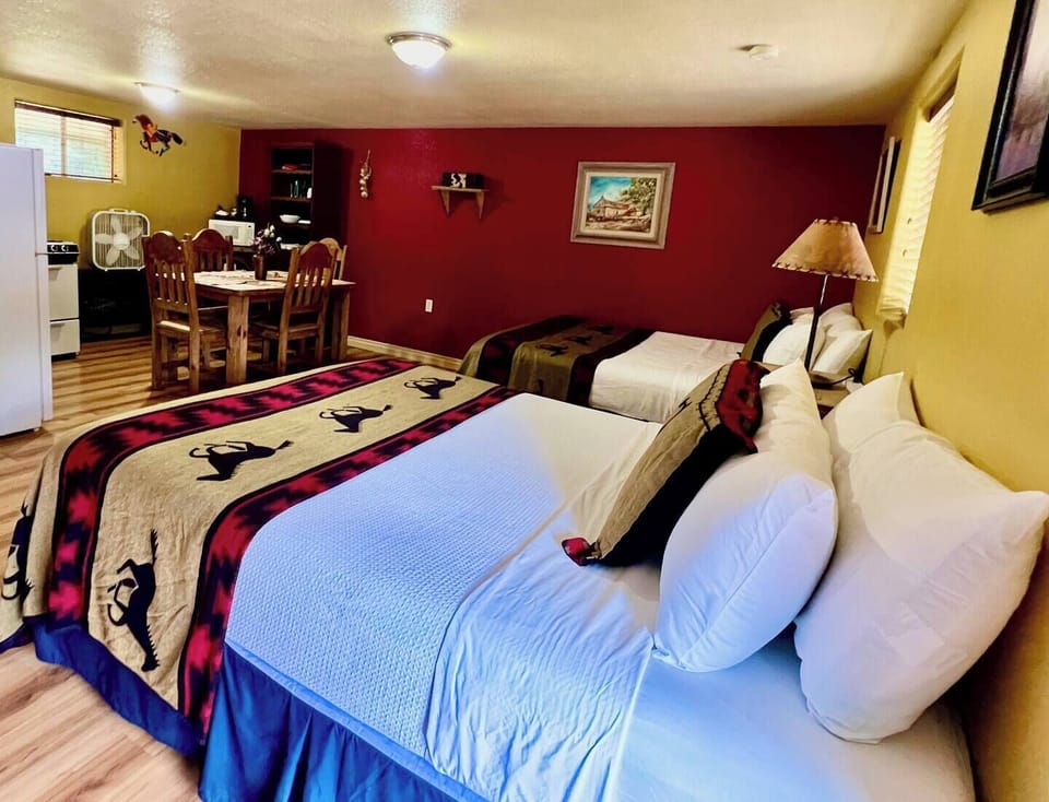 Two queen beds, dining table, full kitchen