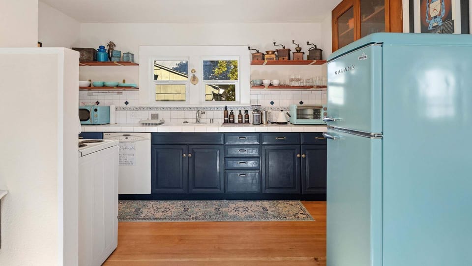 The kitchen has a sleek retro vibe, is fully stocked, and has space for more than one cook. Listen to some music and make a meal together. There is a microwave and toaster oven to add to your convenience. A full oven with stovetop and a refrigerator.