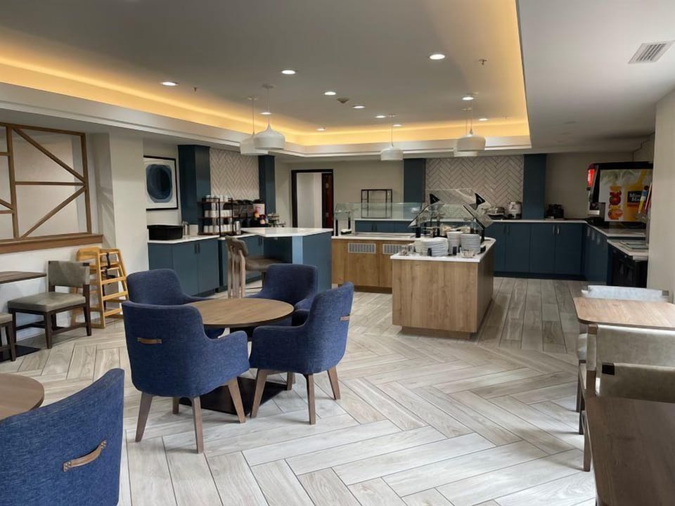 Spacious dining area with tables and chairs.