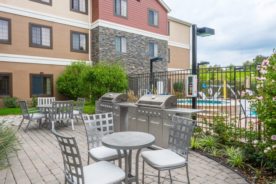 Stainless steel BBQ grills in the garden courtyard, just steps from the outdoor pool