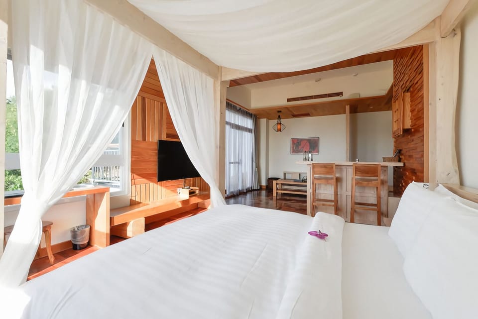 Premium bedding, down comforters, pillowtop beds, minibar