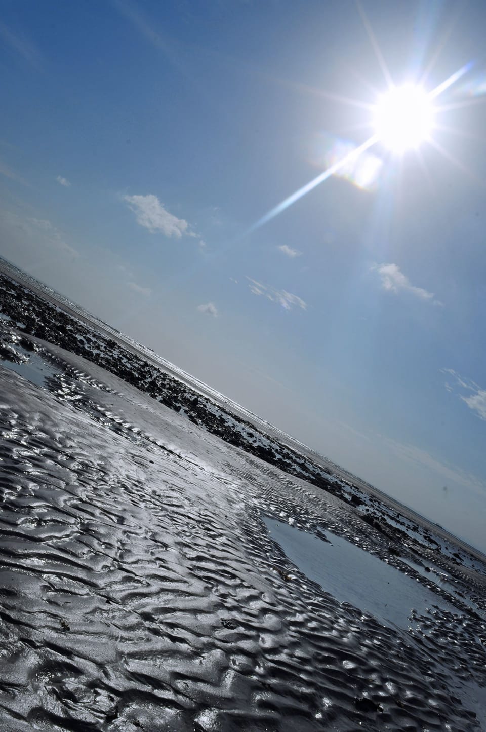 On the beach, white sand, sun loungers, beach umbrellas