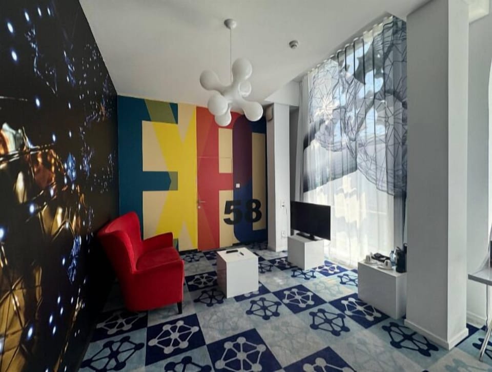 Exclusive Room | Living area | Flat-screen TV