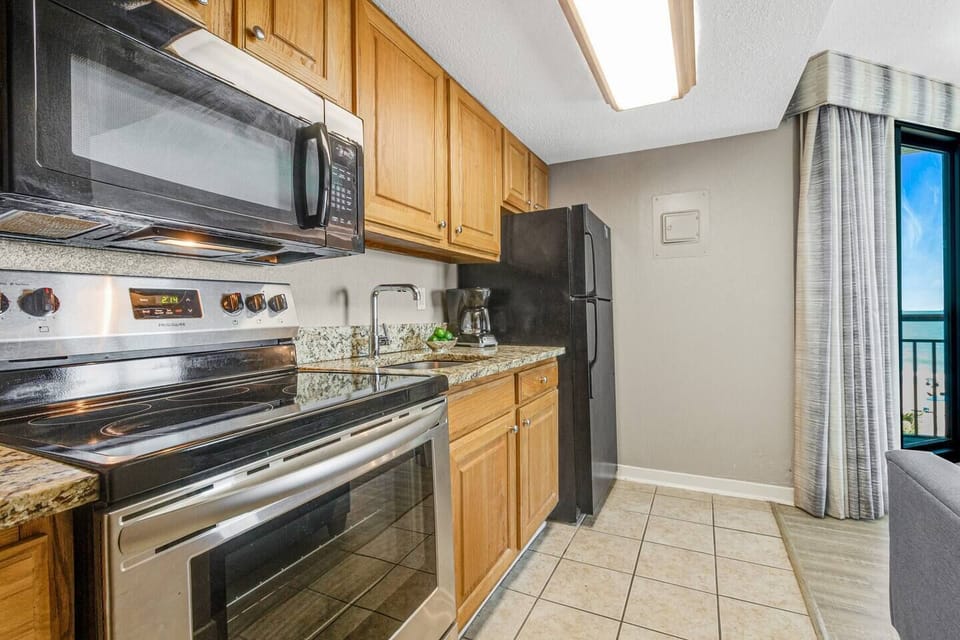 Create culinary masterpieces in a sunlit cooking oasis, with our suite's kitchen bathed in natural light, offering a bright and airy atmosphere for delightful meal preparation.