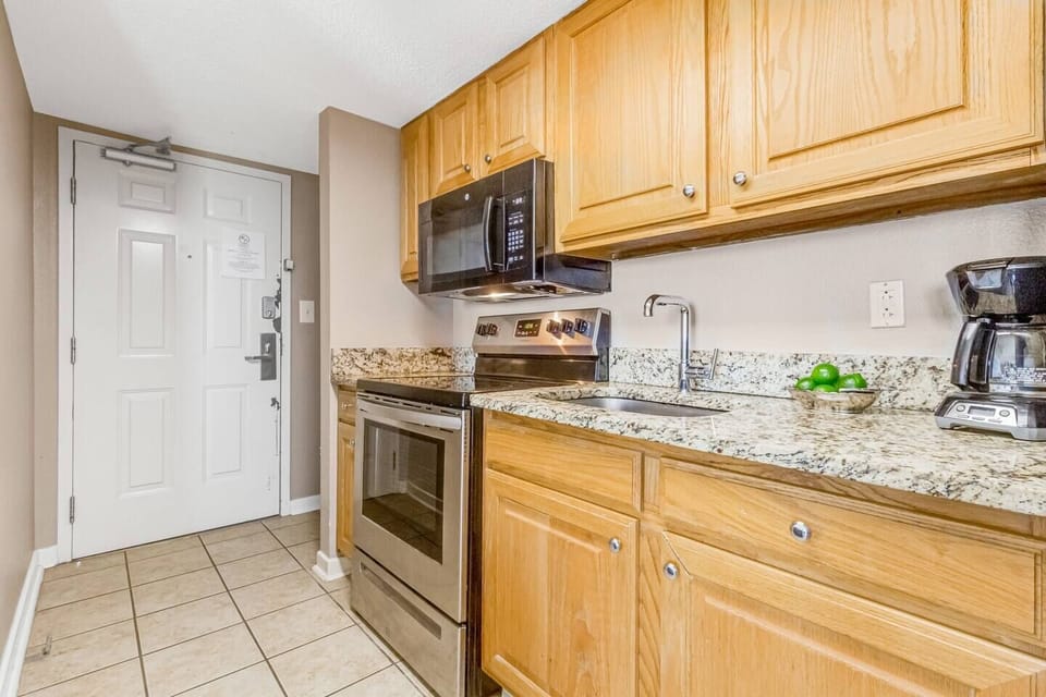 Create culinary masterpieces in a sunlit cooking oasis, with our suite's kitchen bathed in natural light, offering a bright and airy atmosphere for delightful meal preparation.