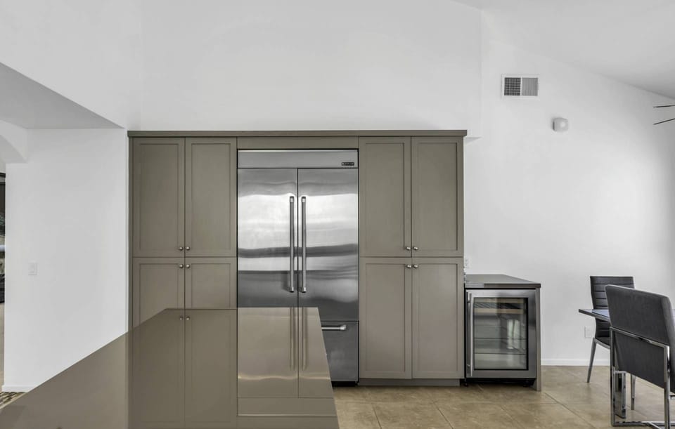 Kitchen with large refrigerator and wine cooler
