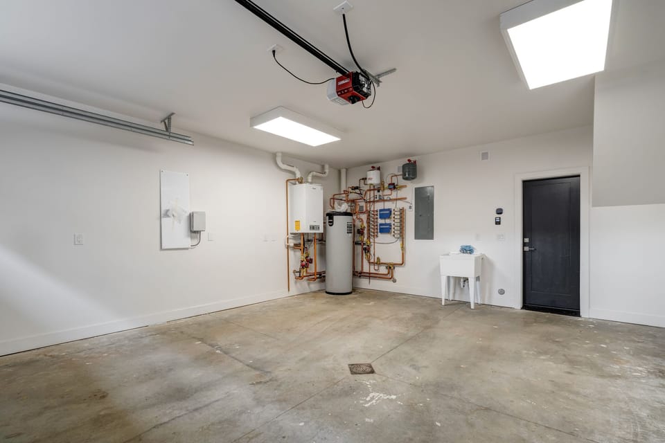 2 car garage with utility sink and gear dryer.