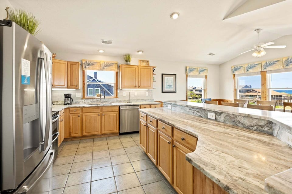 The modern kitchen is fully equipped for preparing everything from quick breakfasts to gourmet dinners.
