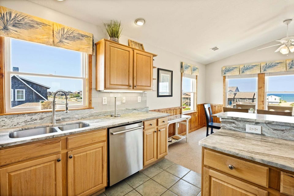 The modern kitchen is fully equipped for preparing everything from quick breakfasts to gourmet dinners.