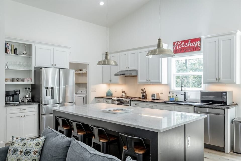 open concept kitchen, living room, and dining