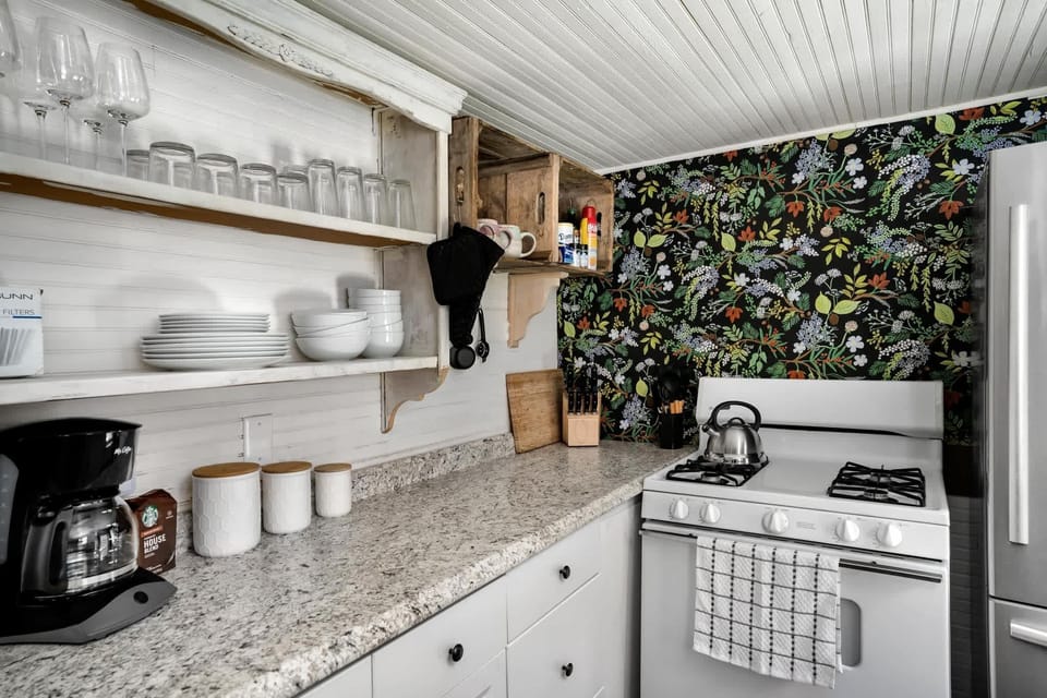 - Fully-stocked kitchen with dishwasher, stove/oven, and microwave
