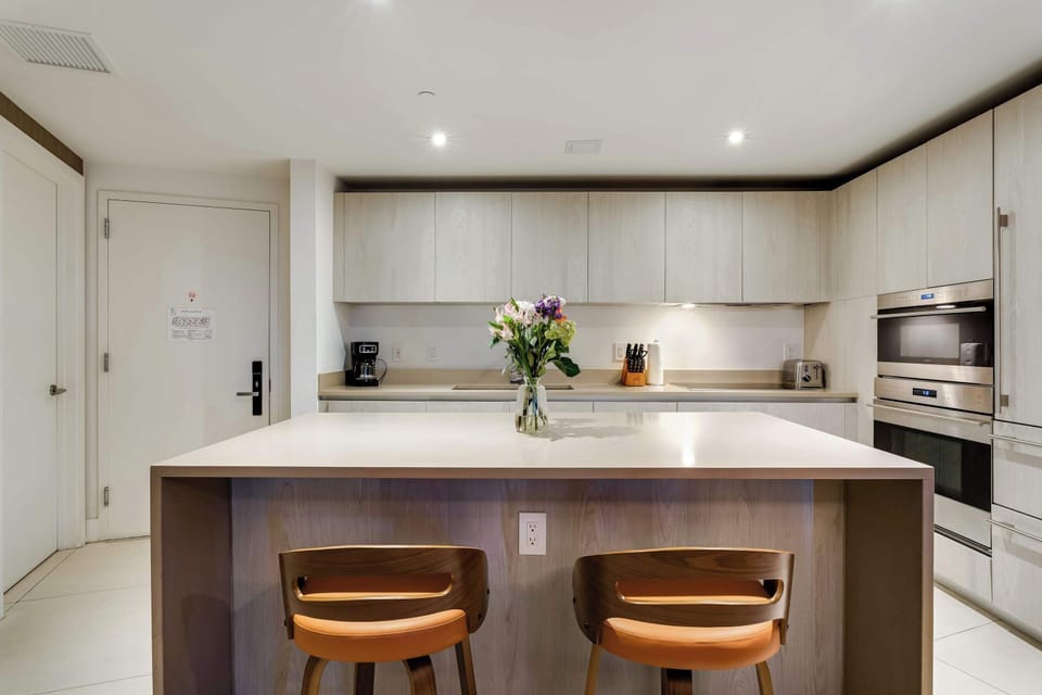 Modern gourmet kitchen with a spacious breakfast bar perfect for entertaining.