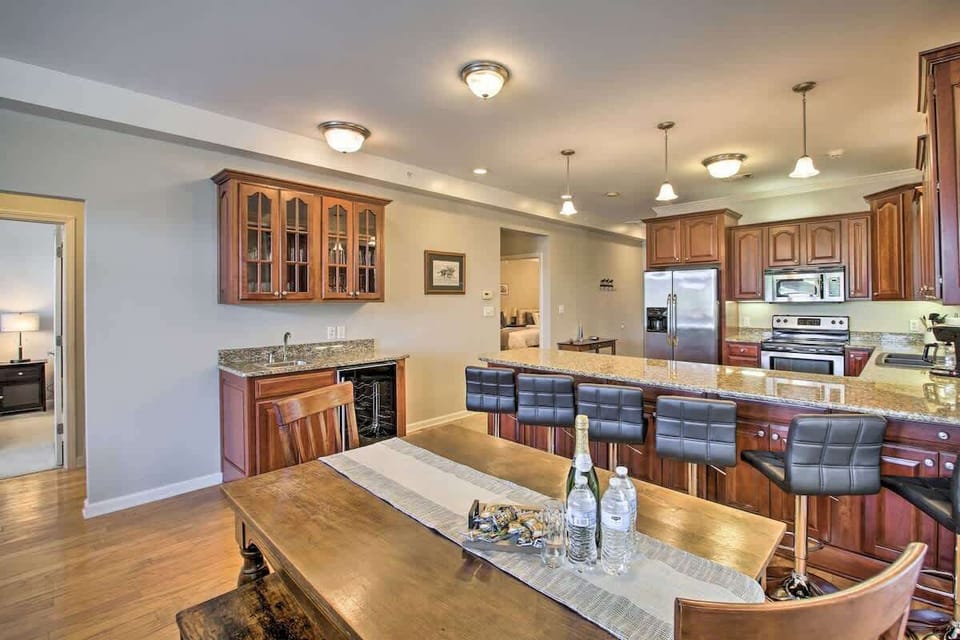 Spacious kitchen with granite countertops, bar seating, and a dining area – perfect for shared meals.