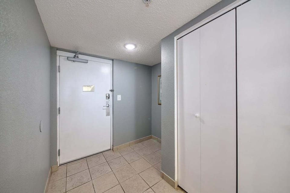 Hallway closet view with main entrance door