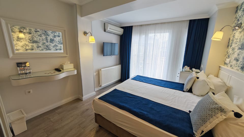 Double or Twin Room | Minibar, in-room safe, free WiFi, bed sheets