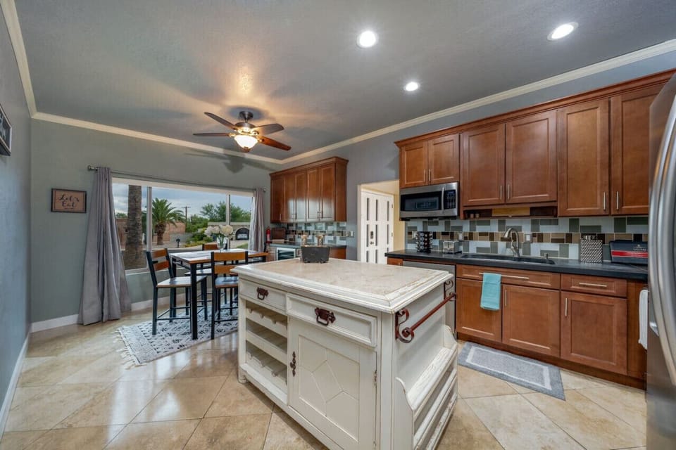 Fully equipped kitchen with island seating — everything you need for home-cooked meals