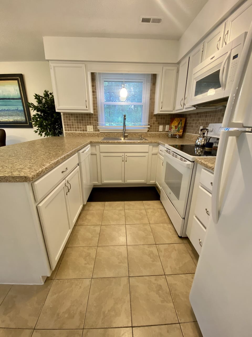 Full Kitchen with large sink and fridge. 