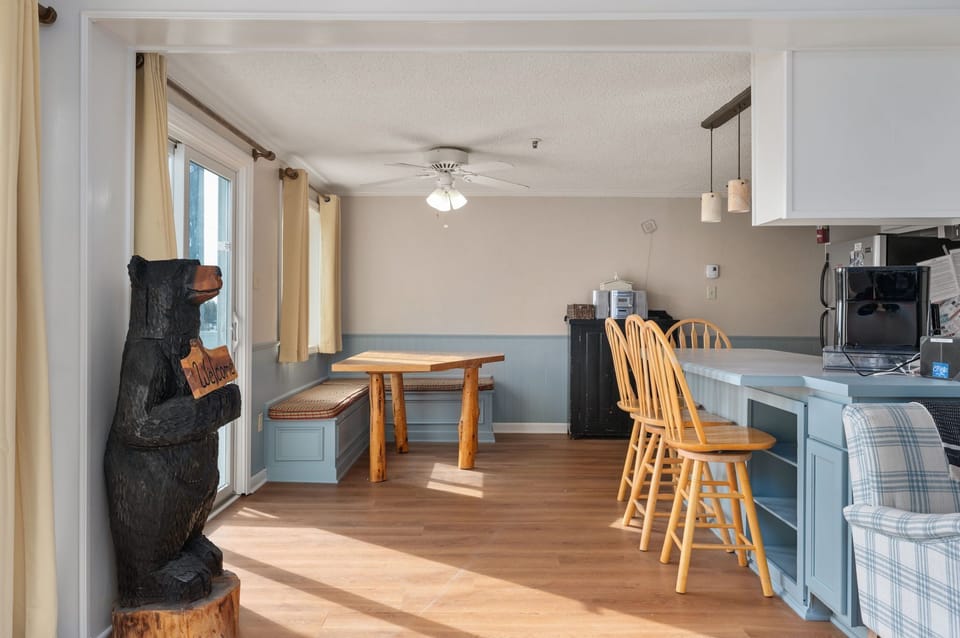 This open-concept space features a fully-equipped kitchen and a dining area!