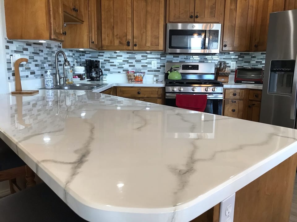 Fully stocked kitchen with stainless steel appliances