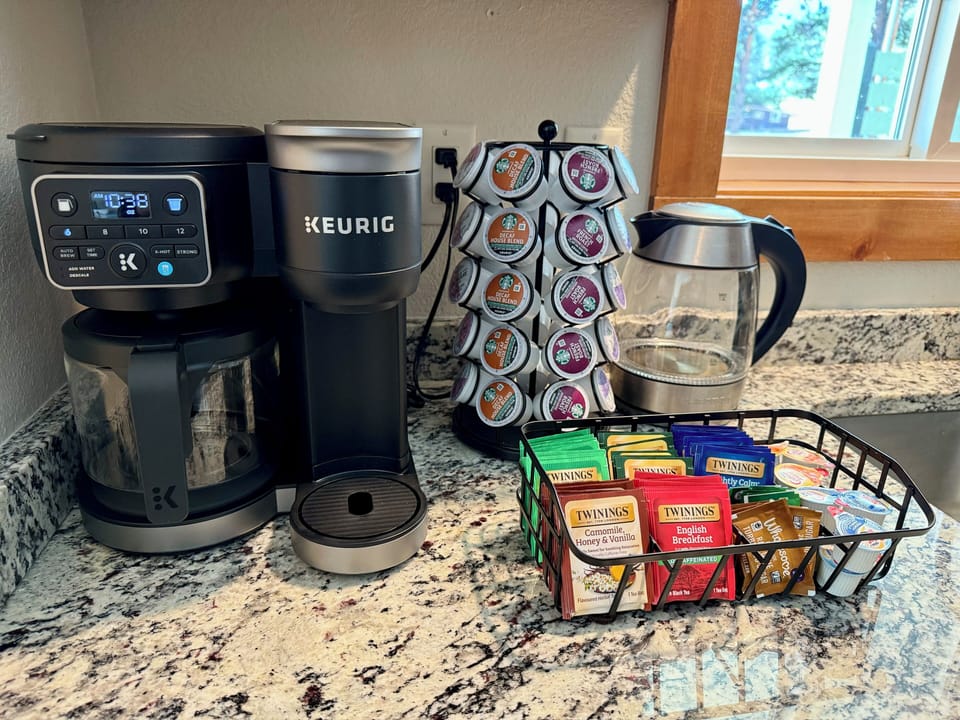 Starbucks regular and decaf coffee, hot chocolate, cream and sugar are provided.