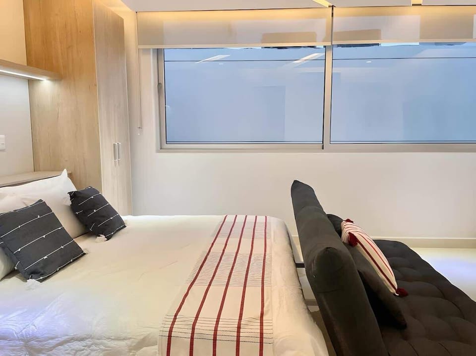 Bright studio living area with large windows
