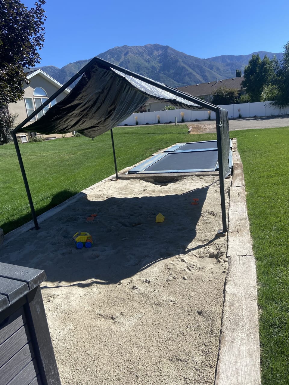 View of sandbox and trampolines