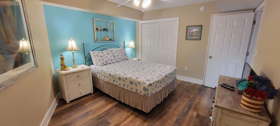 Second bedroom with queen bed and access to second bathroom