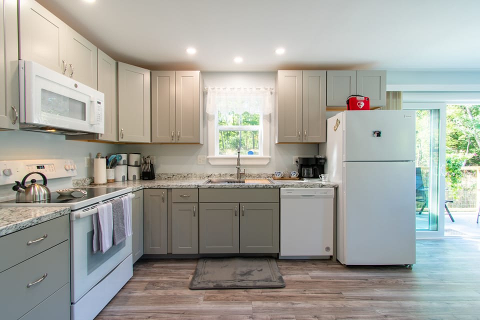 Open kitchen area, a second spacious refrigerator is also available for overflow