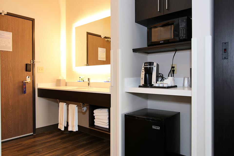 Desk, blackout drapes, iron/ironing board, rollaway beds