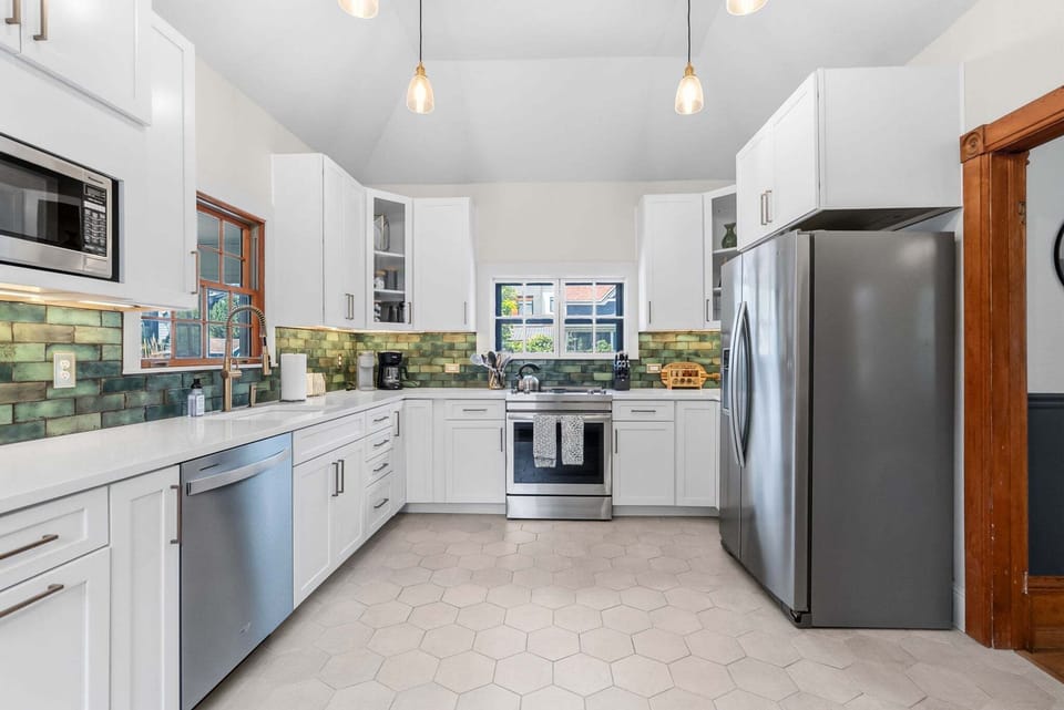 Fully renovated kitchen featuring premium appliances, custom cabinetry, and elegant designer finishes. 🍃✨