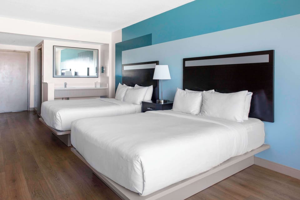 Premium bedding, down comforters, pillowtop beds, in-room safe