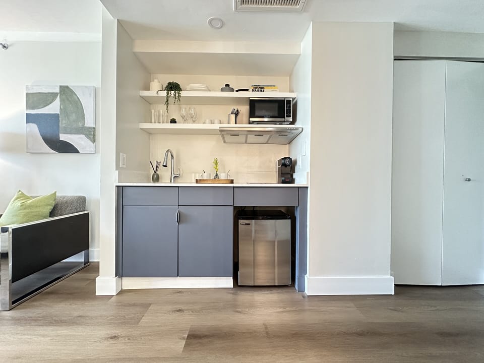 Deluxe Room, 2 Queen Beds, Balcony, City View | Private kitchen | Fridge, coffee/tea maker, paper towels