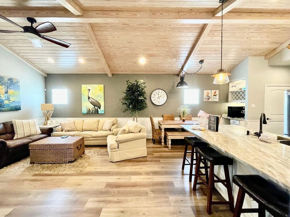 Open-concept comfort with beach-inspired decor and plenty of seating for family gatherings.