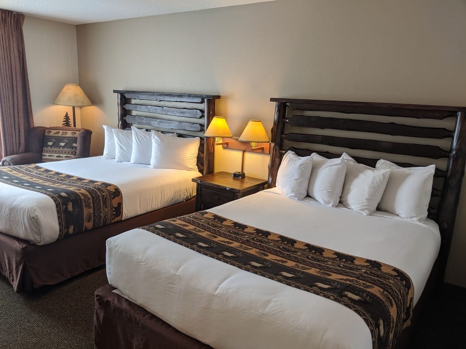 Pillowtop beds, desk, blackout drapes, iron/ironing board