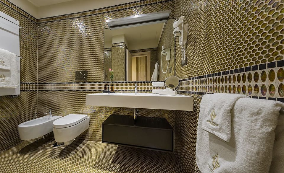 Rainfall showerhead, designer toiletries, hair dryer, slippers
