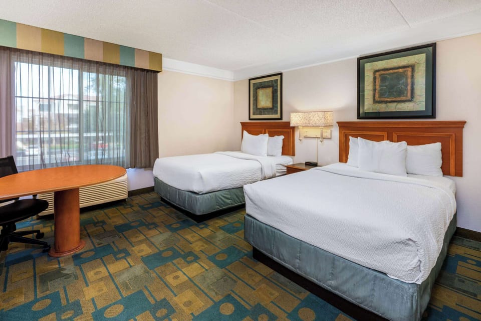 Premium bedding, desk, blackout drapes, iron/ironing board