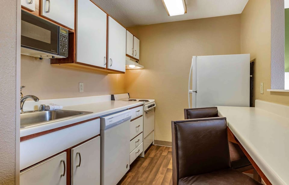Deluxe Studio, 1 Queen Bed with Sofa bed, Non Smoking | Private kitchen | Full-size fridge, microwave, stovetop, dishwasher