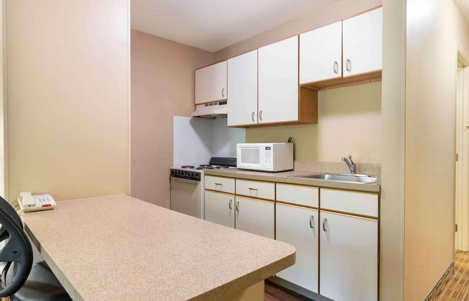 Studio, 1 Queen Bed, Non Smoking | Private kitchen | Full-size fridge, microwave, stovetop
