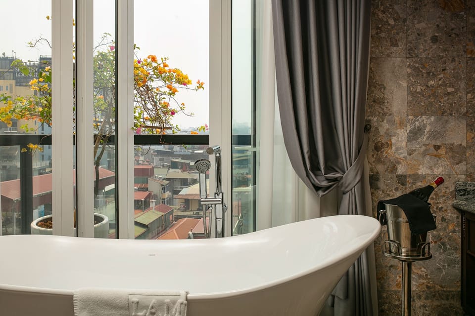 La Mejor Suite | Bathroom | Hydromassage showerhead, designer toiletries, hair dryer, bathrobes