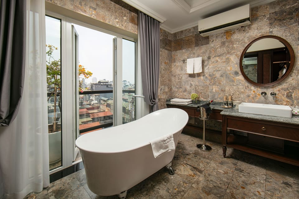 La Mejor Suite | Bathroom | Hydromassage showerhead, designer toiletries, hair dryer, bathrobes