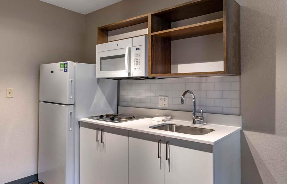 Studio, 1 Queen Bed, Non Smoking | Private kitchen | Full-size fridge, microwave, stovetop, coffee/tea maker