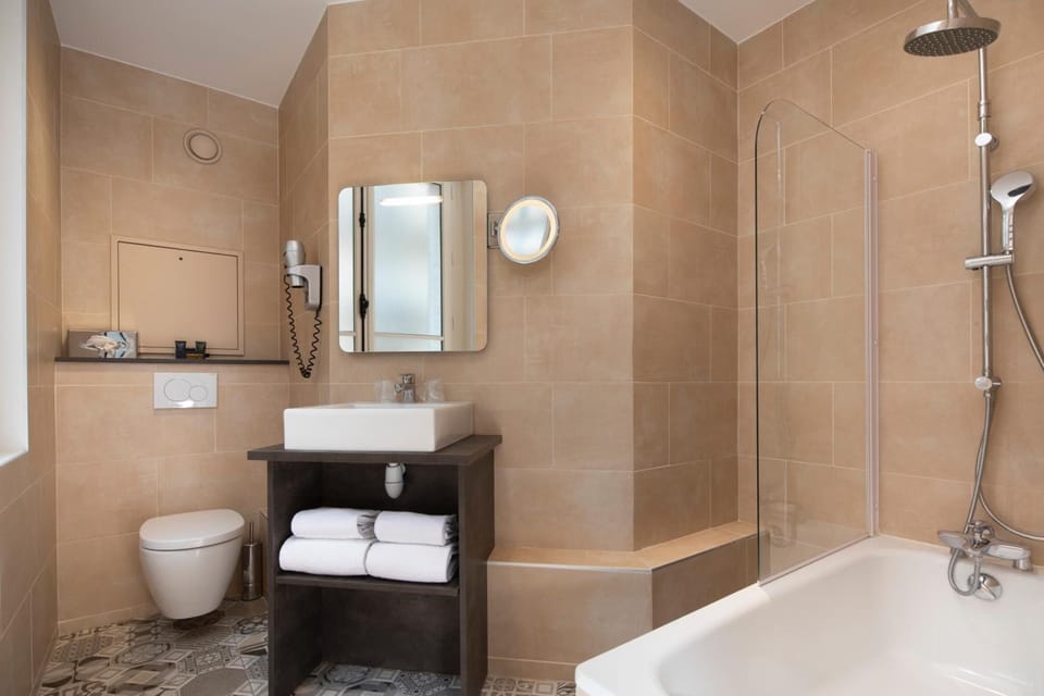 Eco-friendly toiletries, hair dryer, bathrobes, towels