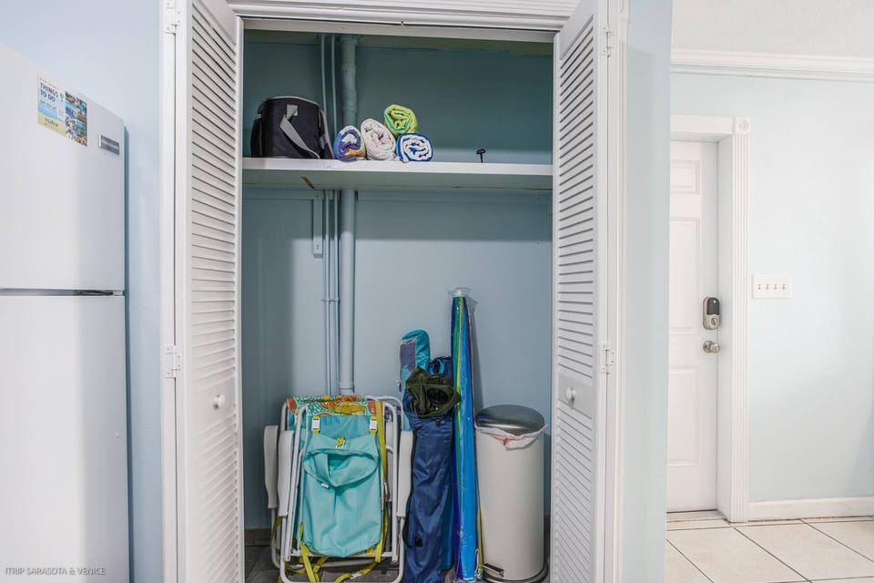Kitchen pantry holds the key to a BEACH DAY!  Cooler, chairs, umbrella and beach towels.