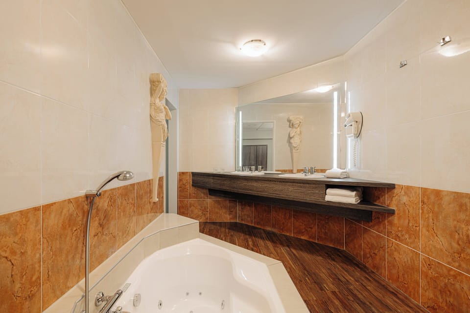 Suite, 1 Double Bed ( Extra Bed possible) | Bathroom | Combined shower/tub, free toiletries, hair dryer, towels