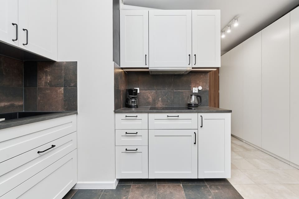 The fully equipped kitchenette includes everything you need for a home-cooked meal.