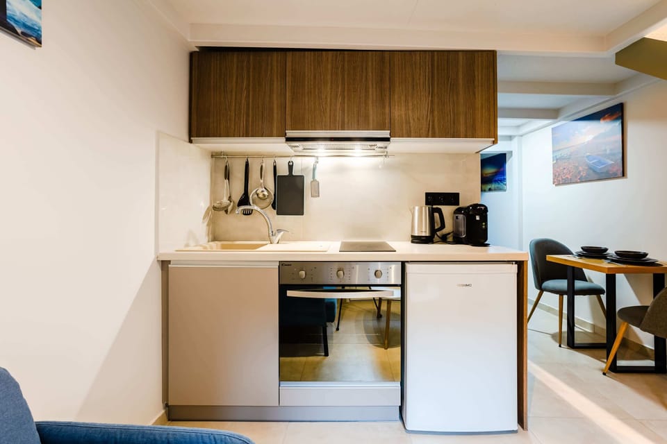 Fully Equipped Kitchen with Modern Cabinets, Built-In Appliances, and Ample Workspace