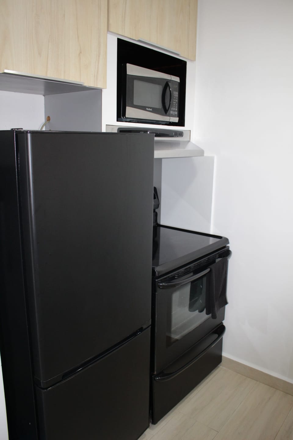 Mid size fridge and full size stove with oven and microwave