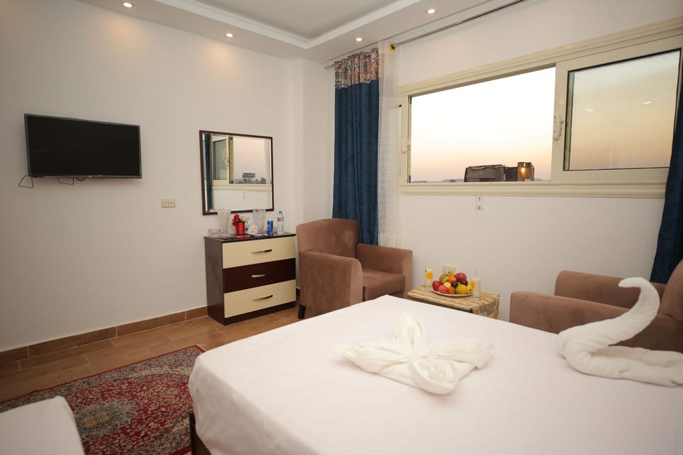 Deluxe Triple Room | Pillowtop beds, minibar, individually decorated, individually furnished