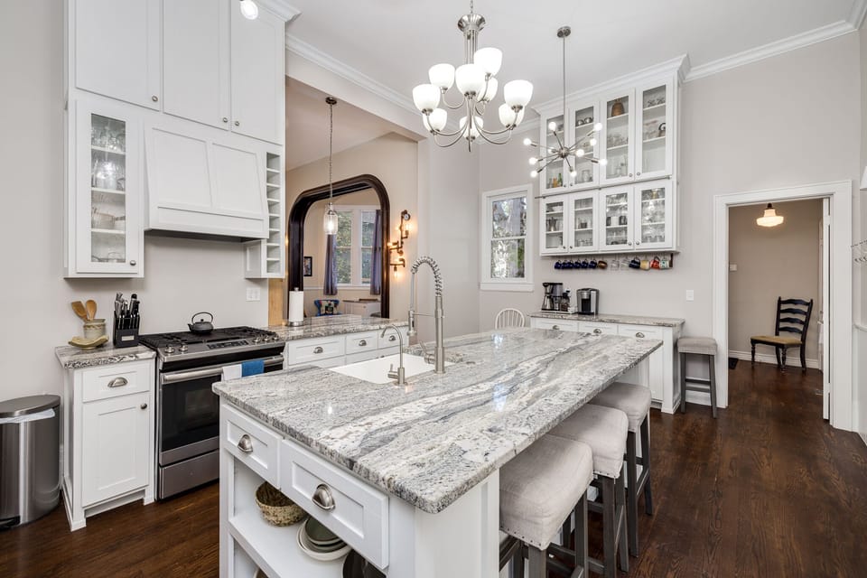 Large bright kitchen fully equipped for cooking and hosting. 