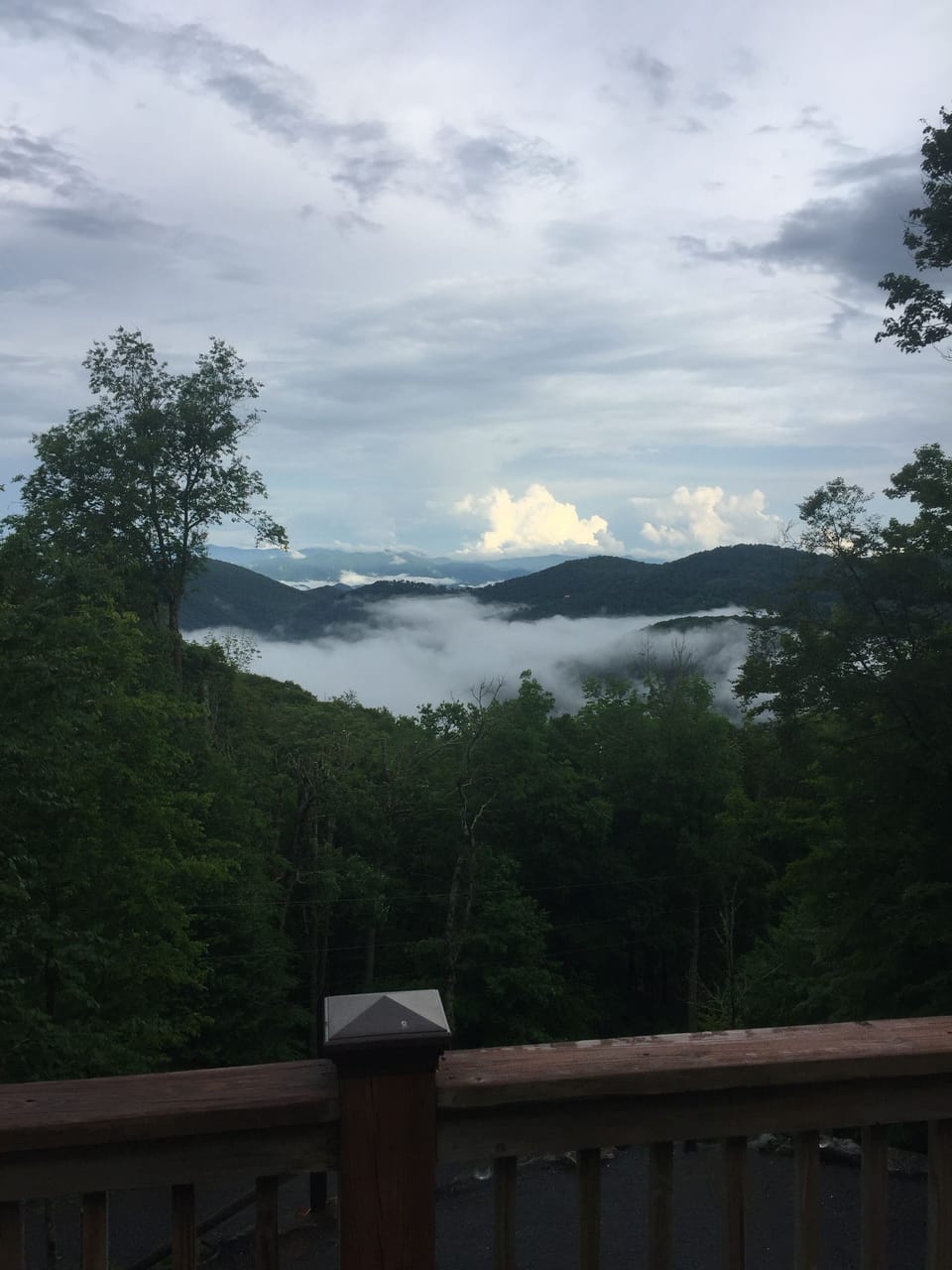 The clouds settle in the valley below after a rain shower offering beautiful vie
